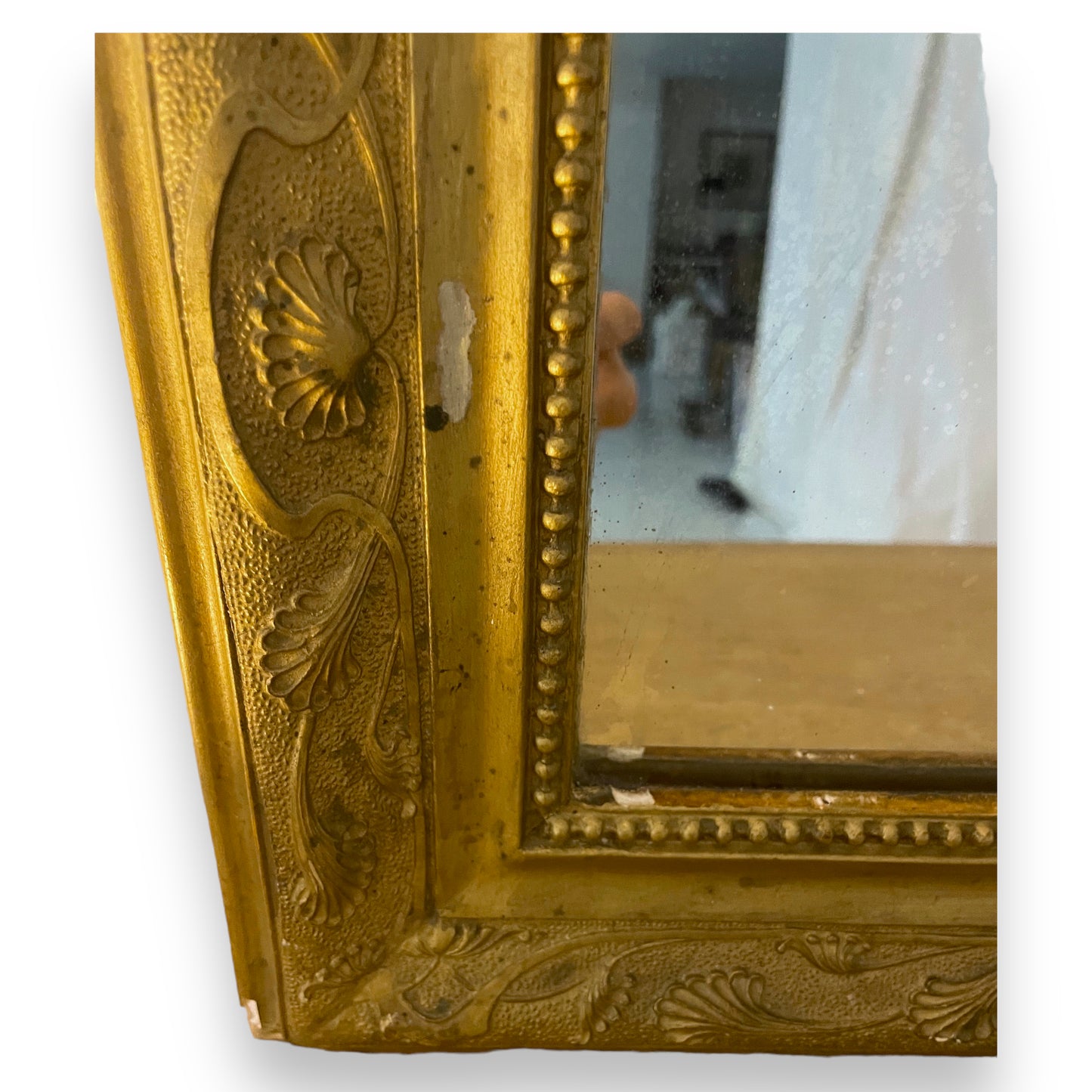 Old gilded mirror with moldings
